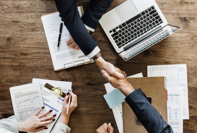 handshake over desk